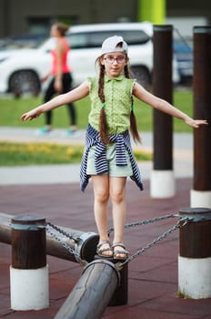 Child girl balancing. Selective focus.