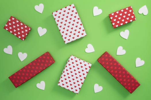 Gift Boxes with little hearts on green cardboards