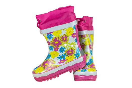 Children shoes and boots. Closeup of a pair pink rubber boots isolated on a white background. Kids shoes fashion.