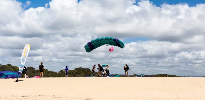Tandem skydive is the awesome rush of exhilarating freefall after leaping out of a plane to land on the beach, in Queensland, Australia