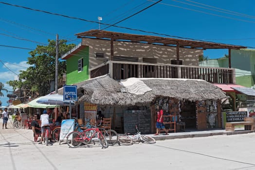Sandy road with tourists and stalls on Holbox Island, Quintana Roo, Mexico located in north yucatan peninsula