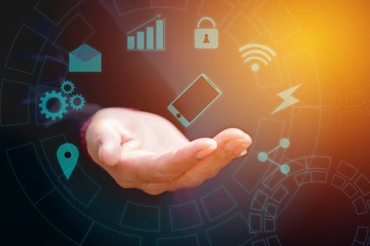 Hand of businessman holding smart phone blue touchscreen. Hand with modern buttons. Businessman hands with virtual screens technology concept.