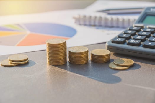 Stock financial indices with stack coin and calculator. Financial stock market in accounting market economy analysis.