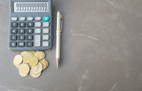 Stock financial indices with stack coin and calculator. Financial stock market in accounting market economy analysis.