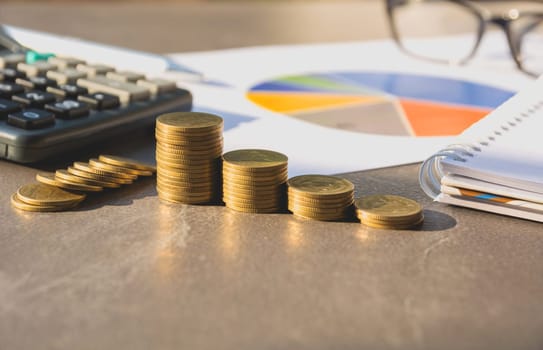 Stock financial indices with stack coin and calculator. Financial stock market in accounting market economy analysis.