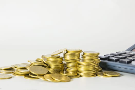 Stock financial indices with stack coin and calculator. Financial stock market in accounting market economy analysis.