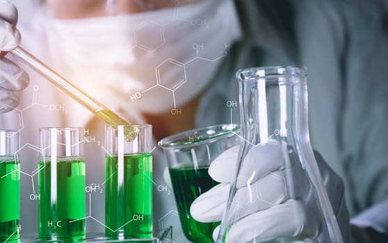 Researcher with glass laboratory chemical test tubes with liquid for analytical , medical, pharmaceutical and scientific research concept.
