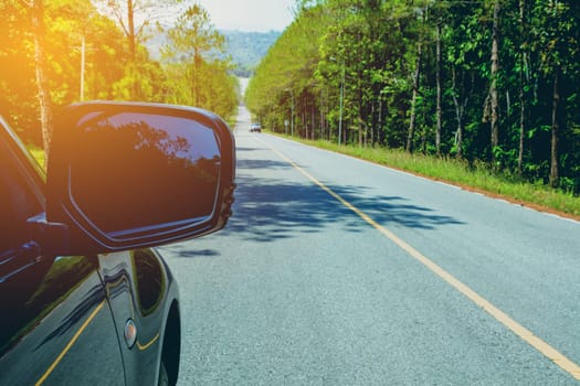 Driving Down the Road. Driving car on asphalt road in summer.