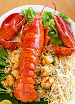 Lobster Pad thai, stir fried Thai rice noodle pasta with whole lobster and lobster meat.