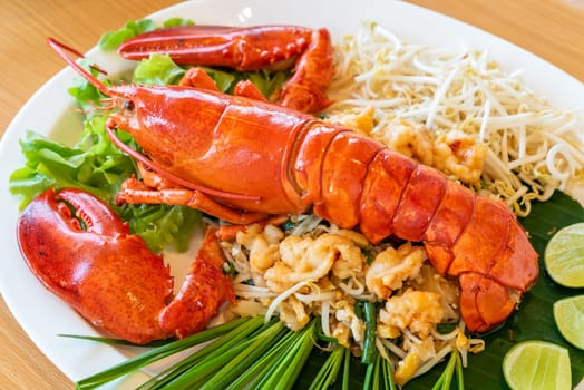 Lobster Pad thai, stir fried Thai rice noodle pasta with whole lobster and lobster meat.