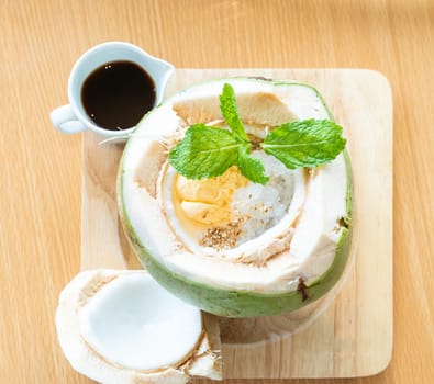 coconut affogato with espresso shot and ice cream italian dessert, served in whole coconut.