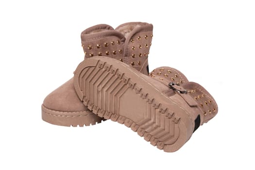 Winter boots. A pair brown suede leather winter boots and lined with fur.  Isolated on a white background. Shoe fashion new collection winter 2018 to 2019.