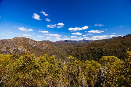 Donaghys Hill walk with Frenchmans Cap in the distance in Franklin-Gordon Wild Rivers National Park on a hot summer's day in Tasmania, Australia
