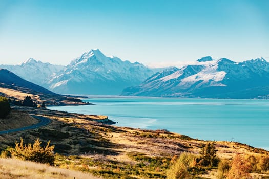 Road to Mt Cook, the highest mountain in New Zealand. Scenic highway drive along Lake Pukaki in Aoraki Mt Cook National Park, South Island of New Zealand.