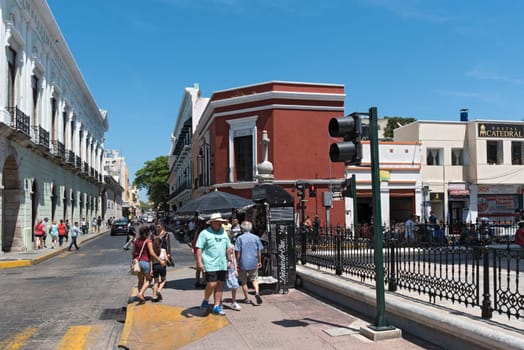 street with houses and shops in downtown merida, mexico.
