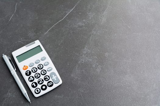 Top view of pen with calculator and copy space for insert text.