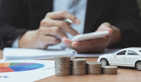 Businessman with car insurance and car services. Car insurance and financial concept.