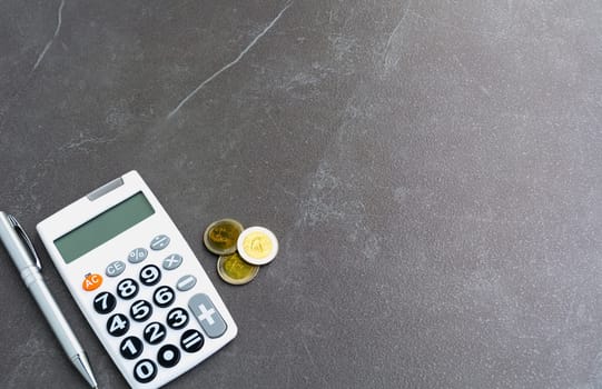 Stock financial indices with stack coin and calculator and copy space for insert text. Financial and accounting concept.