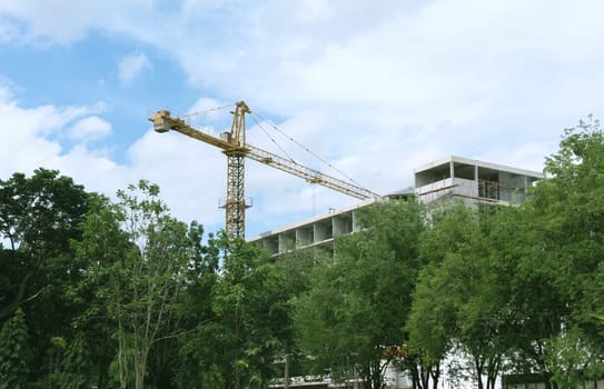 Construction industry building on high ground with sky background.
