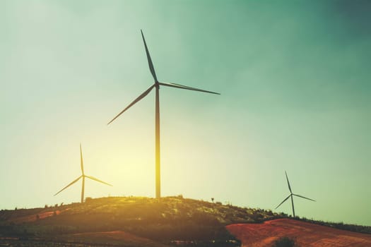 Wind turbines under the sky for technology concept. Wind turbines generating electricity.