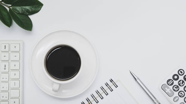Top view of office supplies and notebook on white background and copy space for insert text.