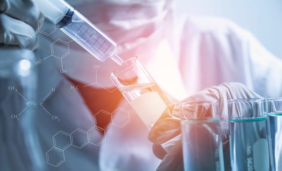 Researcher with glass laboratory chemical test tubes with liquid for analytical , medical, pharmaceutical and scientific research concept.
