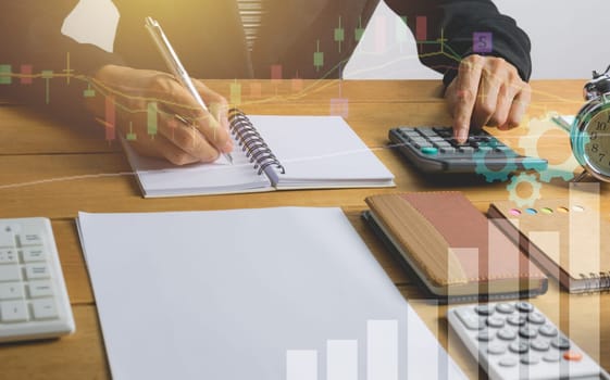 Person working and writing on notebook for financial and accounting concept.