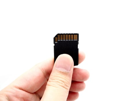 Hand holding a memory card isolated on white background.