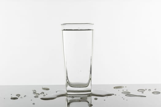 Water glass on white background. Glass with clean drinking water.