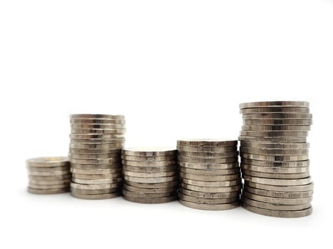 Saving money concept with money coin stack isolated on white background. Financial and accounting concept.
