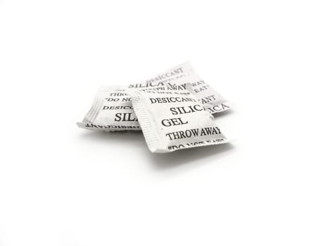 Silica gel packets isolated on a white background.