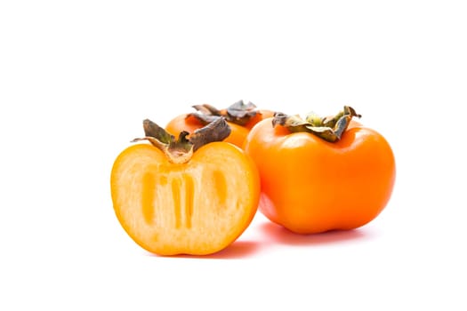 Delicious fresh persimmon fruit isolated on white background.