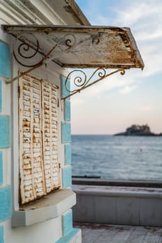 Closed rusty metal shutters of a local cafe in Petrovac, Montenegro
