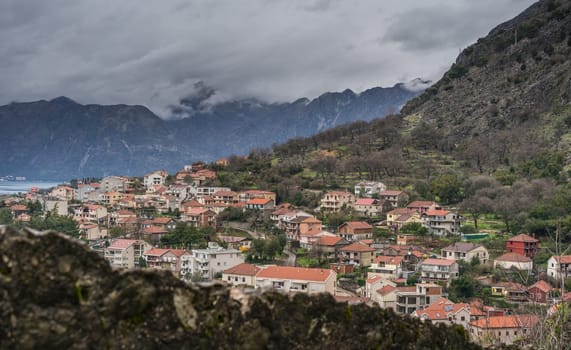 View of the hillside homes in Kotor Bay and town as seen from the small chapel on the hillside above, Montenegro