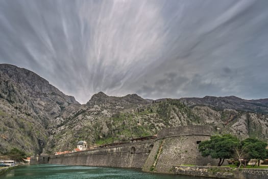 The massive walls of the fortification Bastion Riva by the river Shkurda in Kotor Old Town, Montenegro