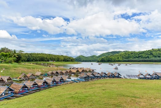 Bamboo raft shelter are floating restaurant in the middle of water under the blue sky as a tourist attraction at Huai Krathing Reservoir, Loei province, Thailand