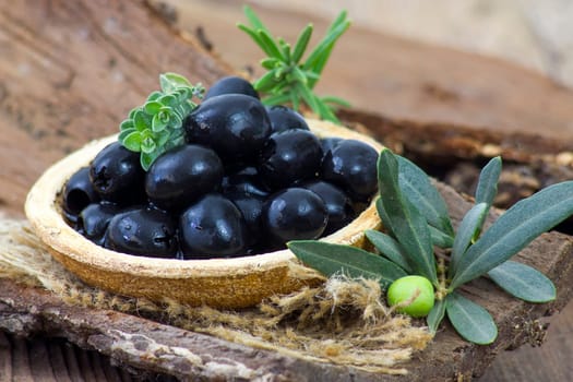 black olives and herbs in a bowl