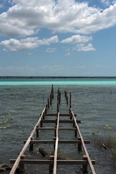 Old broken pier at the lagoon of Bacalar, Quintana Roo, Mexico.