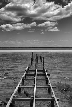 Old broken pier at the lagoon of Bacalar, Quintana Roo, Mexico.