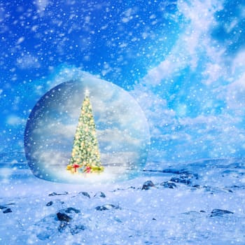 Conceptual image of decorated Christmas tree with colorful lights and ornaments in glass sphere on snow covered landscape