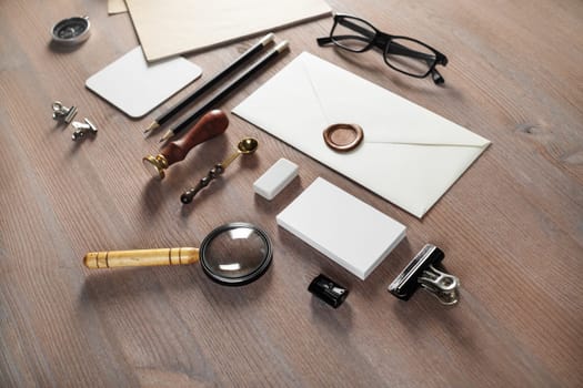 Vintage stationery set on wooden background. Responsive design mockup. Selective focus.