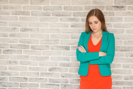 Young woman with headache, holding head, sad, sad brooding