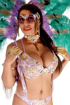 A beautiful young woman in a carnival outfit with big feather on her .head and gorgeous bra and pantie, isolated for white background.