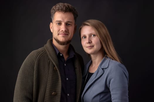 Portrait in the studio of two young business partners standing face to face