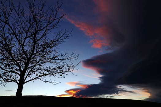 At sunset an uncanny storm comes up in the sky
