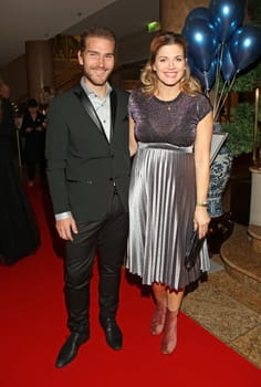 Nina Bott ( pregnant) and husband Benjamin    at the University Gala Hamburg