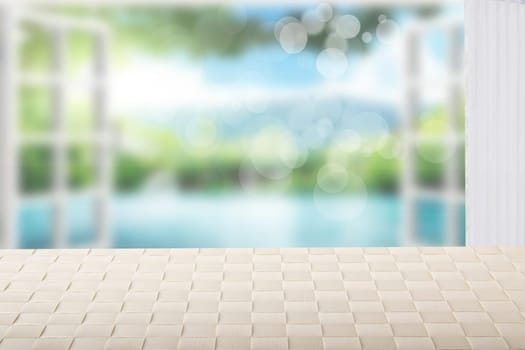 Table top on sunny beach background. A empty bright table on blurred abstract beach with  blue sky and bokeh lights. Template for your product display montage. Summer and holiday concept.