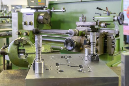 Machine workshop with lathe machine and bench vise