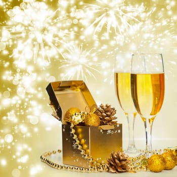 Glasses of champagne on sparkling holiday background with fireworks