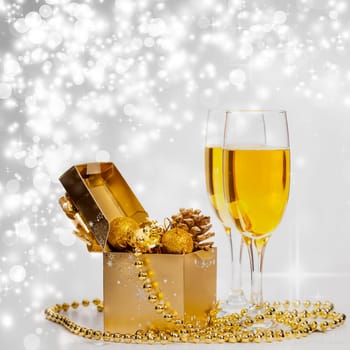 Glasses of champagne on sparkling holiday background with fireworks